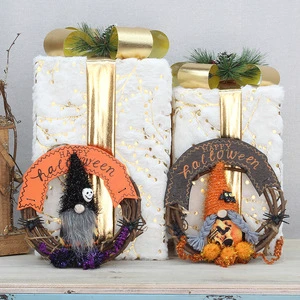 Halloween-themed decorative items: faceless dolls, realistic spider decorations, vine wreaths, and hallway or wall hangings