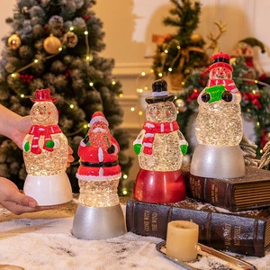Christmas decorations: Snowman, Old Man, crystal ball, music box, wind lantern, gifts, candles
