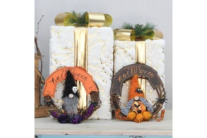 Halloween-themed decorative items: faceless dolls, realistic spider decorations, vine wreaths, and hallway or wall hangings