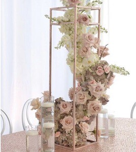 Attractive floral wedding centerpiece with antique metal craftsmanship for luxury table decor and wedding themes