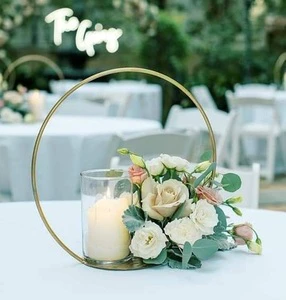 Handcrafted Gold Metal Wedding Table Centerpiece with Artistic Floral Engravings and High Quality Construction for celebrations
