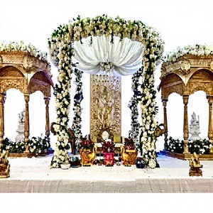 Royal Radha Krishna Theme Wedding Stage Decoration Grand Gujarati Wedding Event Stage Traditional White Gold Wedding Stage