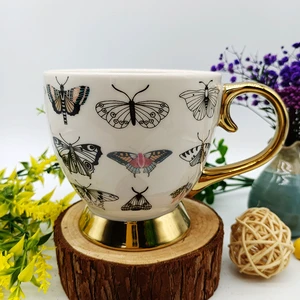 Hot Sale Butterfly Silk Screen Decal Pattern Electroplate Golden Handle Ceramic Footed Mug