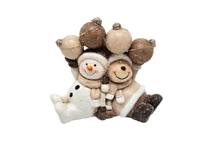Christmas snowman ornament made of resin, perfect for holiday decor on your living room table
