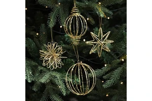 Creative metal holiday ornaments designed with snowflakes, Christmas trees, bells, stars, and festive symbolic patterns