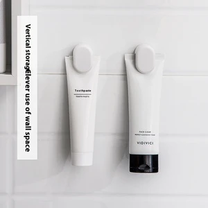 Novelty Wall-Mounted Bathroom Storage Holder with Convenient Adhesive Hooks Plastic Design for Toothpaste Facial Cleanser Hanger