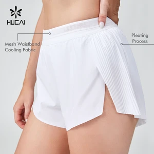 HUCAI OEM Custom Polyester Spandex Ladies Loose Split Hem Pleat Back Mesh Waistband Gym Sports Workout Running Shorts For Women