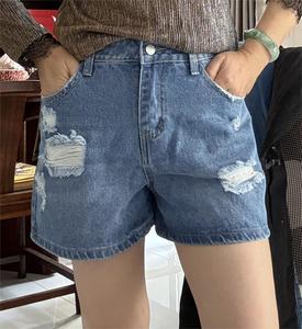 Wholesale women's denim shorts with stylish holes and washed water shorts are suitable for ladies.