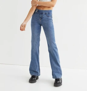 OEM Wholesale Price Denim Blue Slim Fit Flared Low Jeans for Women