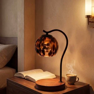 Adjustable Height Tortoise Shell Glass Candle Warmer Lamp With Black Metal Arm And Wood