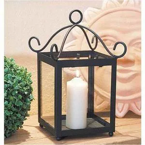 Black iron candle lantern with hanging loop and weather resistant build suitable for porch patio or festive event lighting