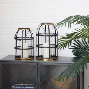 Large black iron lantern with clear glass sides designed for high visibility of candles or fairy lights in dark corners