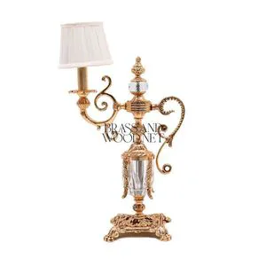 Antique brass and crystal decorative table lamp with ornate base and small fabric shade for luxury interiors